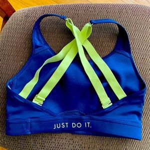 Nike brand women’s sports bra with adjustable cross-back.  Breathable material.